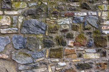 Stone cladding texture formed by old rustic stones and bricks