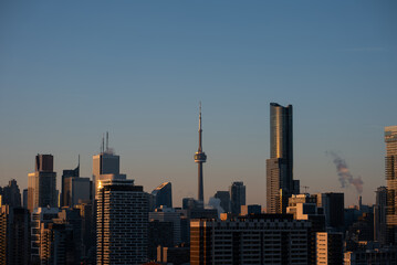 sunset over Toronto city downtown skyline, sunrise over CN Tower and skyscrapers of financial district Canada