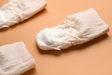 Period panties on orange background, closeup