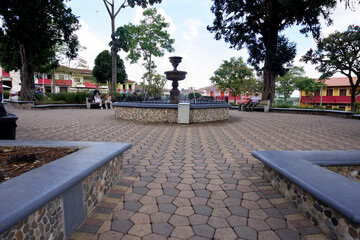 Caramanta, Antioquia, Colombia; March 28, 2024: Distant view of the water fountain located in the...