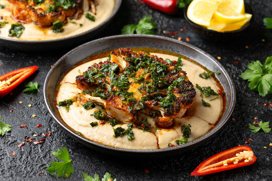 Cauliflower steaks with chimichurri sauce and butter bean puree