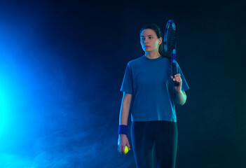 Tennis player woman with racket on tournament. Girl athlete with racket on open court with neon colors. Download a high quality photo for design of a sports app or tour events.