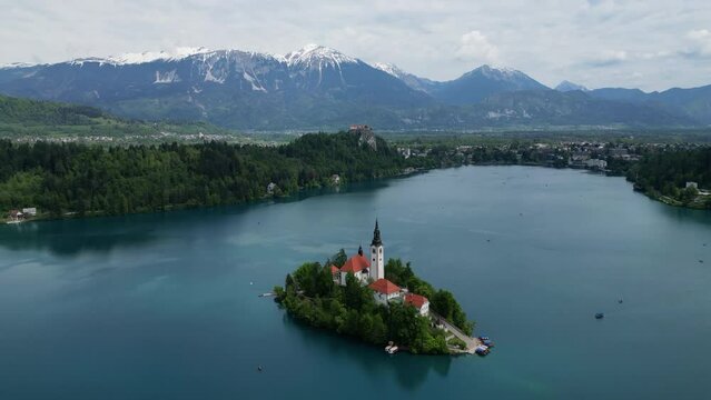 Aerial view of Bled lake with Church on a small island and castle, Slovenia, 4k