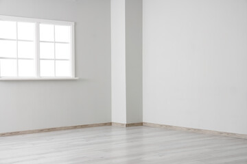 View of empty room with window and laminate floor