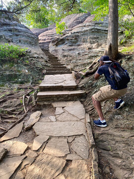 Africa American Male Taking a Picture in a National Forest rocky stairways