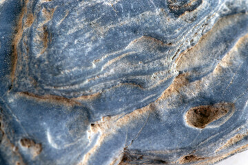 Layered natural stone with metallic texture  close-up  macro photo.