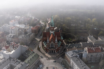 Aerial view of Podgorski Square with St. Joseph's Church during foggy morning in Podgorze District...