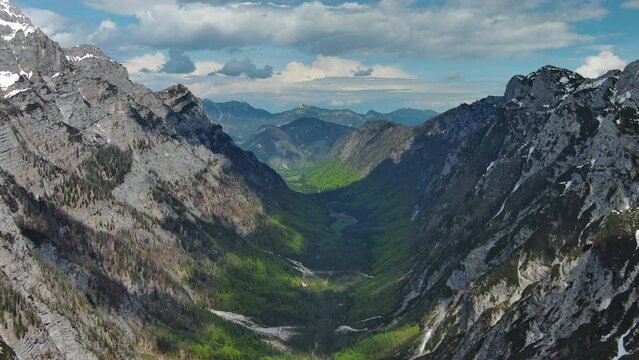 Aerial view of breathtaking peaks and green valley in Julian Alps mountain. Triglav National Park, Slovenia, 4k