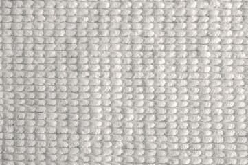 looped cotton fabric. Skeins of plush yarn for hand knitting with ready made loops. Background from...