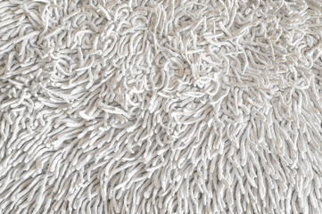 looped cotton fabric. Skeins of plush yarn for hand knitting with ready made loops. Background from a set of fleece curly threads. Yarn with loops. Needlework.