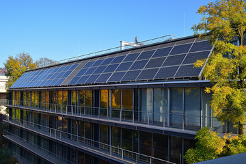 Obraz premium photovoltaic solar panels producing ecological green renewable energy on the roof of the house, generative AI