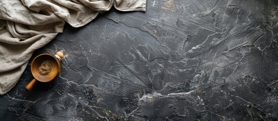 Stone kitchen table with a towel seen from above, with space for text.