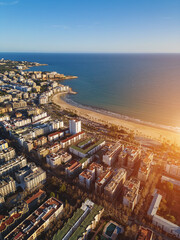 sunset over streets of Spanish touristic city Salou, Catalonia, aerial view of beach, sea and coast with hotels - obrazy, fototapety, plakaty