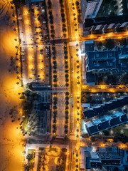 illuminated streets of Spanish touristic city Salou, Catalonia, aerial view of beach