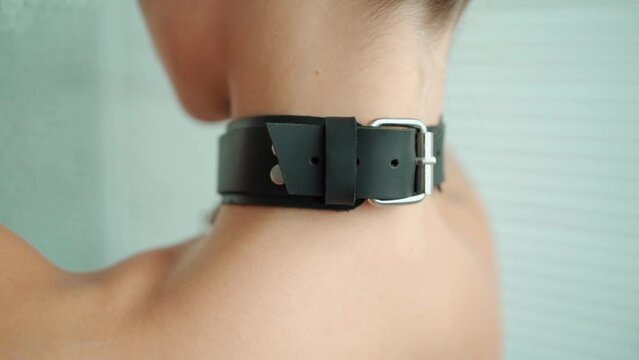 dominant sex role play game with toys, sexy woman in bdsm leather collar with chain