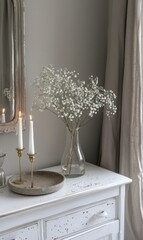 White Dresser With Mirror and Flower Vase