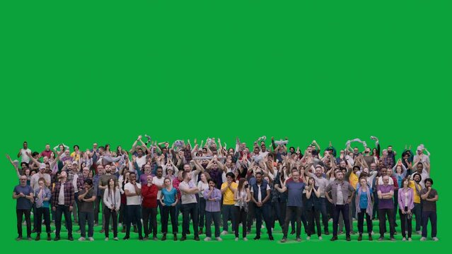 Big crowd of supportive sports fans gesticulate and shout watching football match on stadium. Group of multiethnic people cheering for soccer team playing in international championship. Chroma key.