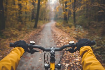 A person biking on a forest path among trees and natural landscape