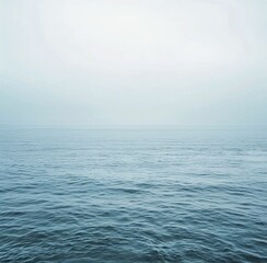 Obraz premium Large Body of Water Under Cloudy Sky