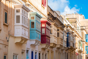 Cozy street and traditional colorful wooden balconies in Sliema, Malta - 791168316