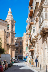 Cozy street and traditional colorful wooden balconies in Sliema, Malta - 791168379