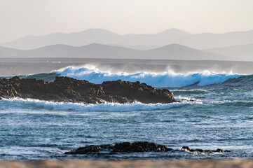 West coast of Fuerteventura island. Winter sea and sun vacation in El Cotillo touristic village, Canary islands, Spain. White sandy beach La Concha..