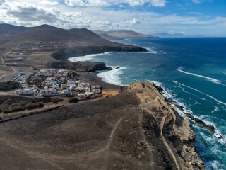 West coast of Fuerteventura island. View on blue water and black caves of Ajuy village, Canary...