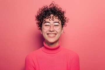 Fototapeta na wymiar Smiling with Style: Person in Fashionable Glasses on Solid Background