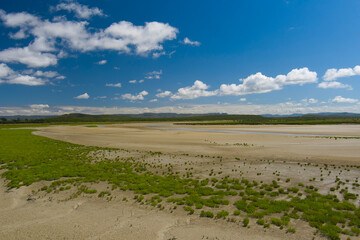 landscape with sky and large open sand beach