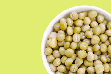Canned green peas on white background.