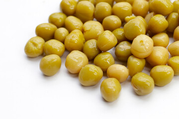 Canned green peas on white background.