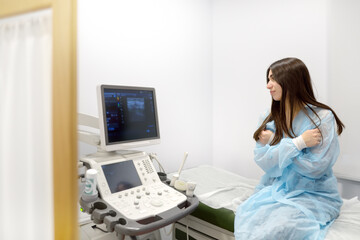 A young woman at a mammologist's appointment for examination of mammary glands and lymph nodes. Patient waiting of gynecological ultrasound exam. - 791185517