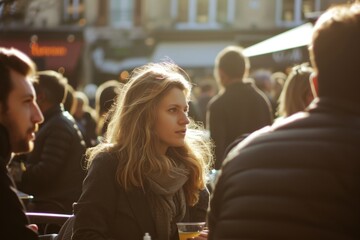 Young woman in a cafe on the street in Paris, France.