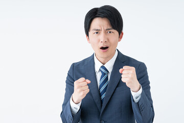 怒る若い日本人のビジネスマン