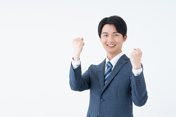 ガッツポーズをする若い日本人のビジネスマン