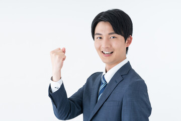 ガッツポーズをする若い日本人のビジネスマン