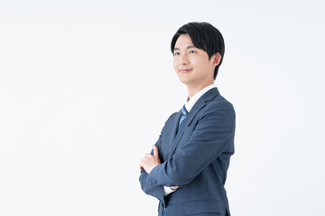 Obraz na płótnie Canvas 腕組みをする若い日本人のビジネスマン