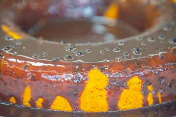 carrot cake with chocolate icing in selective focus