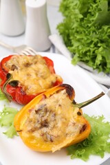 Delicious stuffed peppers on white table, closeup