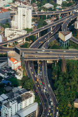 Multilevel junction highway in Business district with skyscrapers in Bangkok, Thailand. Traffic and transportation concept - 791198515