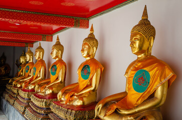 Row Of Buddha statue in beautiful Wat Pho Temple of Reclining Buddha in Bangkok, Thailand