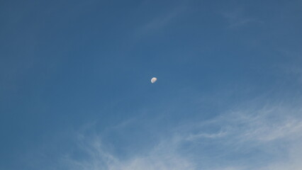 The moon at the clear blue sky photo