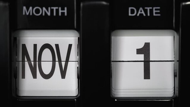 retro flip calendar with a date change from the thirtieth of November to the first of December. daily calendar with a change of days of the month. calendar concept, reminders, events. close up.