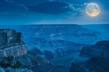 Fotobehang midnight moon overlooking a vast, blue, mountainous landscape In the style of an album cover © BOMB8