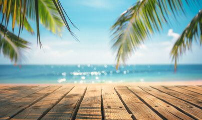 Wooden table top with wooden planks and blurred beach background, palm leaves and blue sky in summer for product display montage