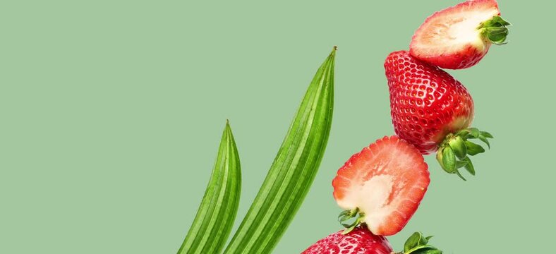 Animation of strawberries and leaves, moving on the green background