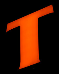 Luminous 'T', bold orange, contrasted dark background