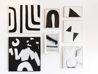 Trendy black and white wall art, on a white wall, minimalist interior design wall art, abstract spaces, created by a graphic designer, serenity.