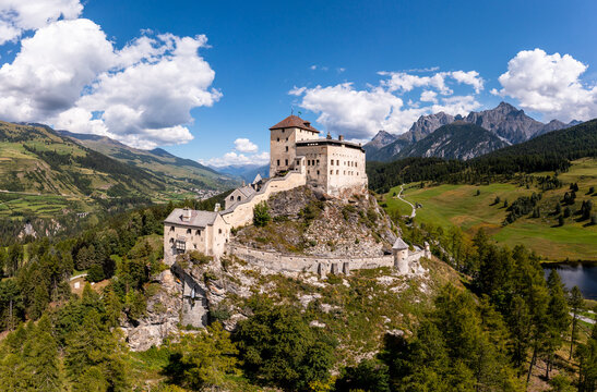 Aerial view of the famous Tarasp castle near Scuol in the alps in Canton Graubunden in Switzerland on a sunny summer day.
