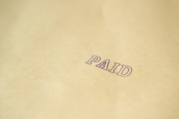 Paid invoice and Rubber Stamp on paper ,